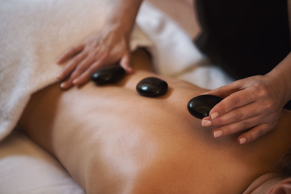 Woman getting a hot stone massage