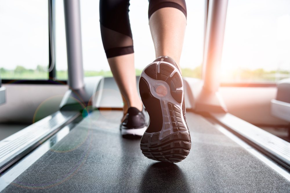 A woman walking on a treadmill