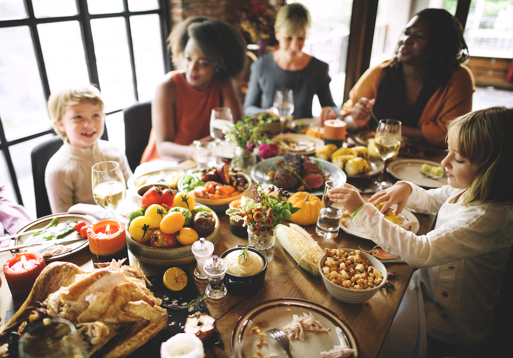 A big family shares a Thanksgiving meal together