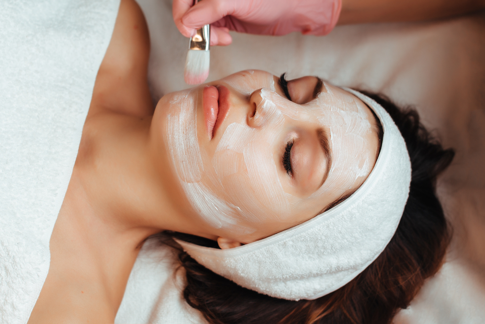 A woman recieving professional facial services 