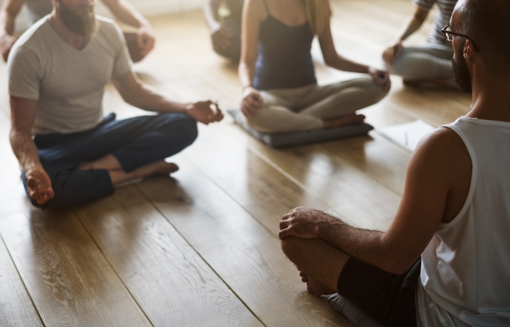 A group of people attending a class at the yoga studio in Kansas City