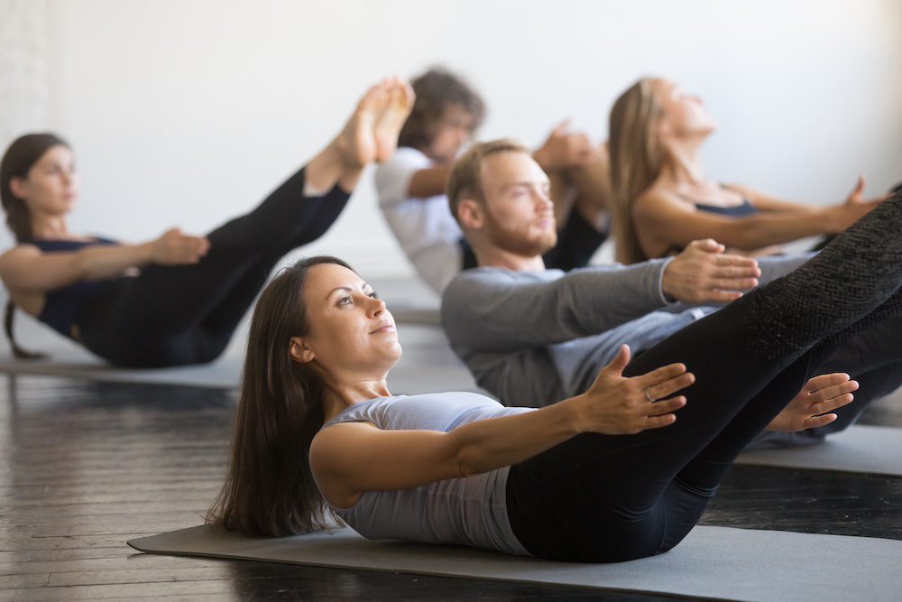 A group of students attending a pilates class
