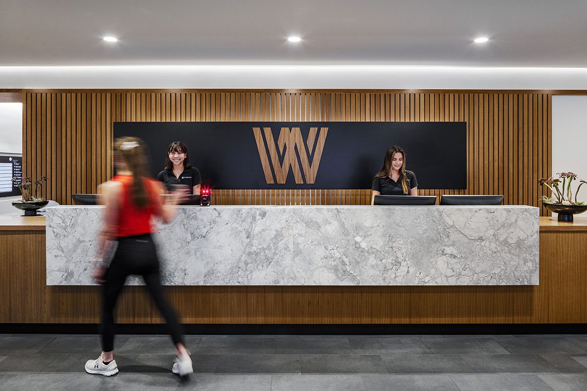 Front desk of woodside that members walk past for westwood fitness