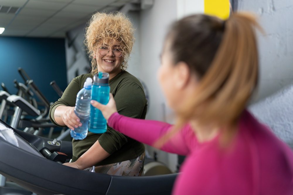 two women enjoying their cycling classes near me