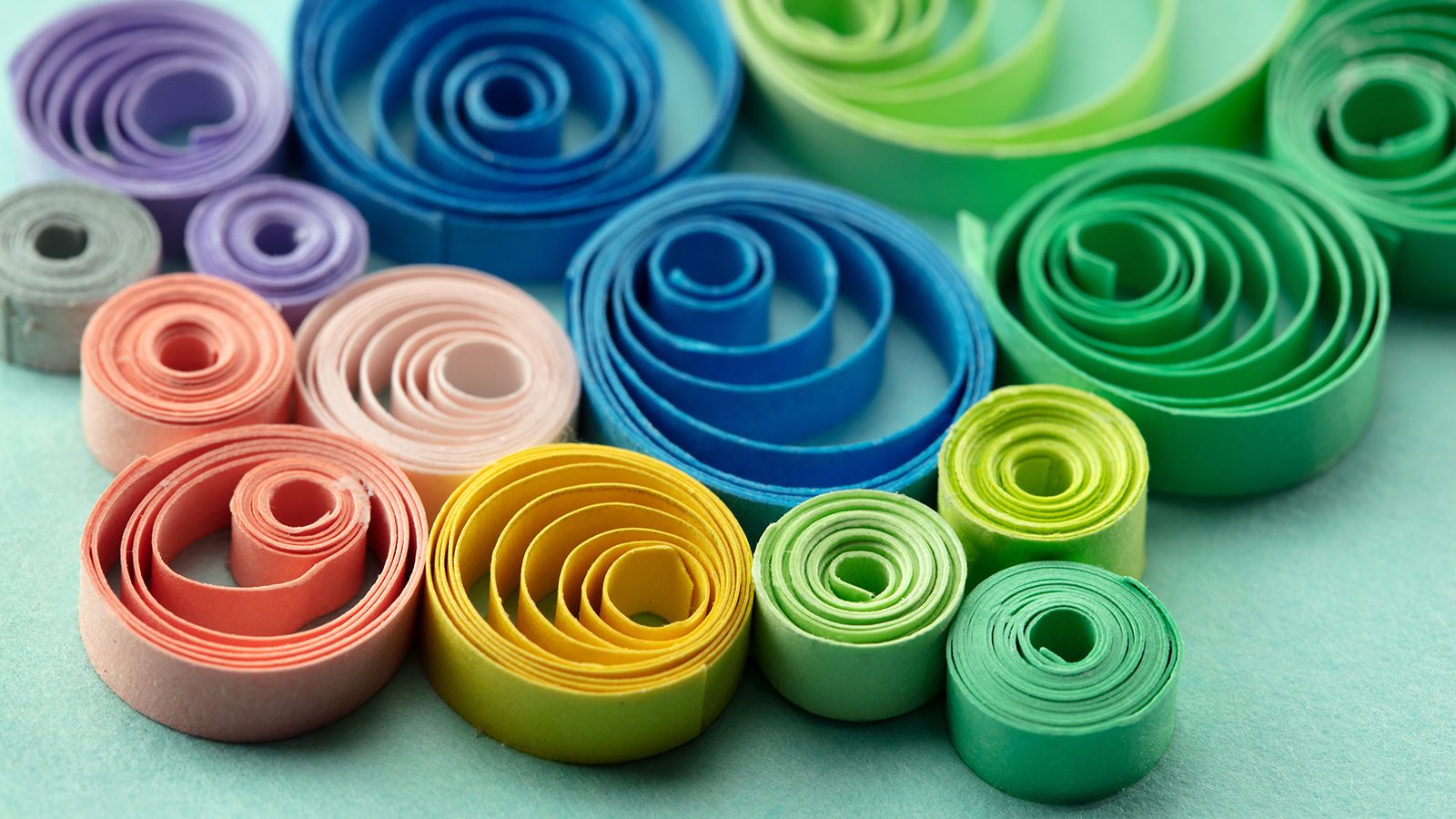 Paper quilling, or quilled paper. Spectrum of coiled paper strip